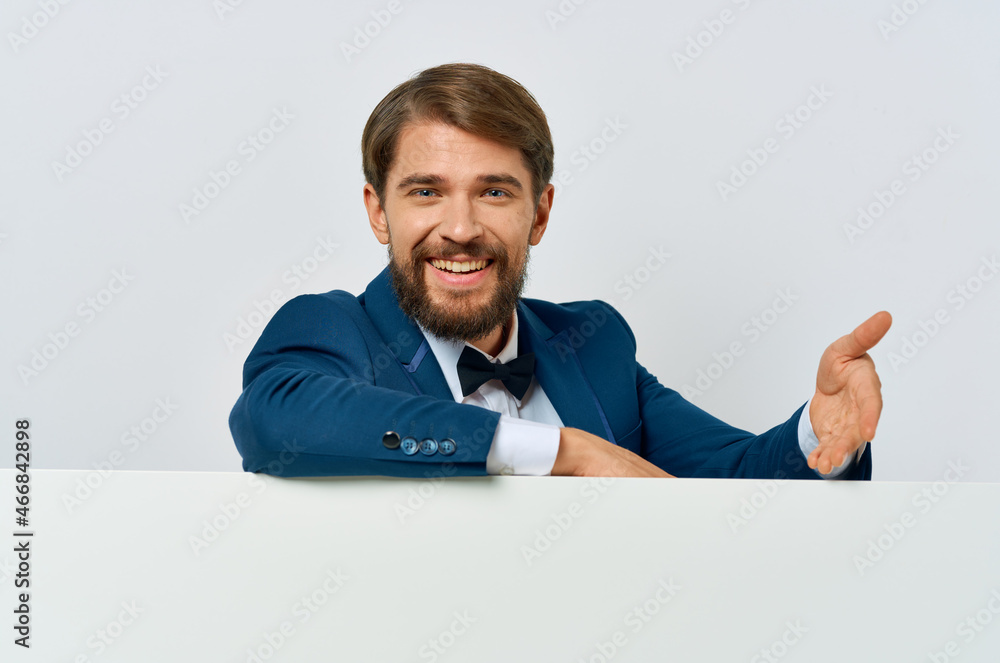 Cheerful man white banner in hand blank sheet presentation White background Cheerful man white banner in hand blank sheet presentation White background