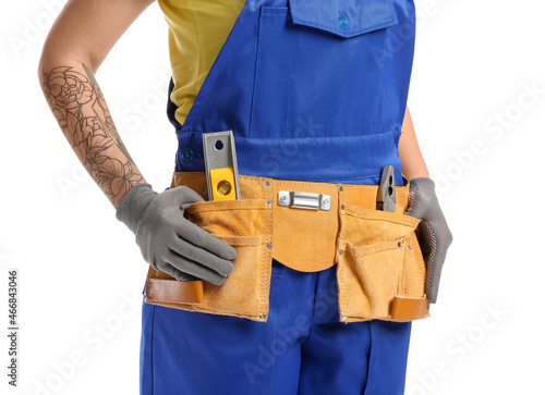 Female construction worker with tools on white background © Pixel-Shot