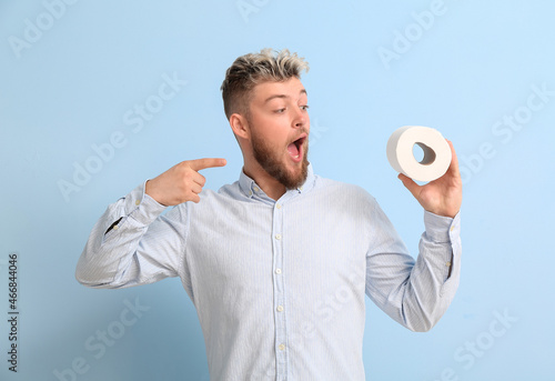 Young man with toilet paper...