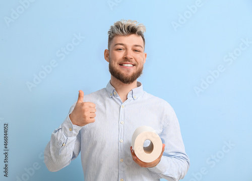 Young man with toilet paper...