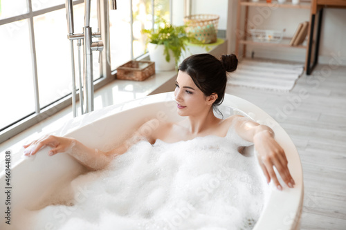 Relaxed young woman taking ...