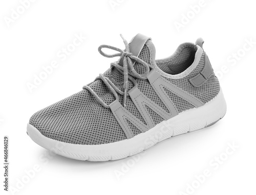 Sportive shoe with tied lace on white background