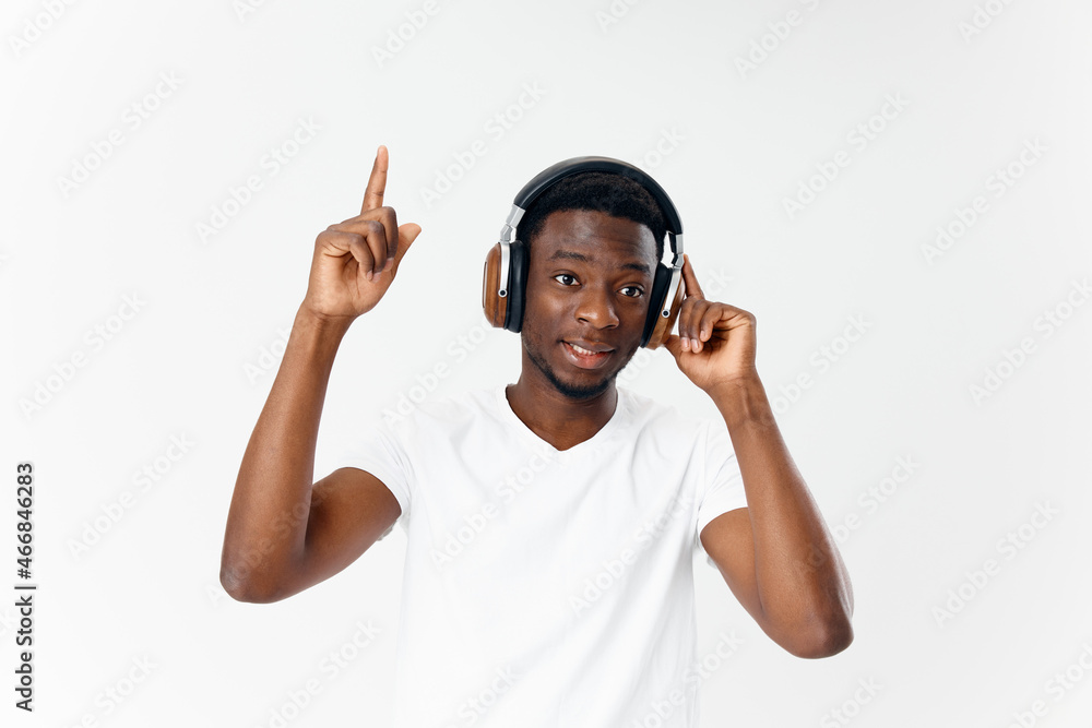 man african appearance on headphones gesturing with hand music lover man african appearance on headphones gesturing with hand music lover