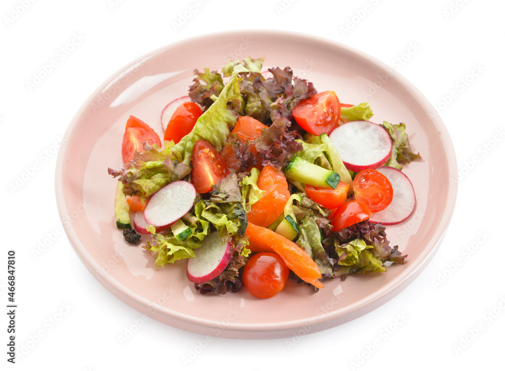 Delicious salad with salmon and vegetables in plate on white background