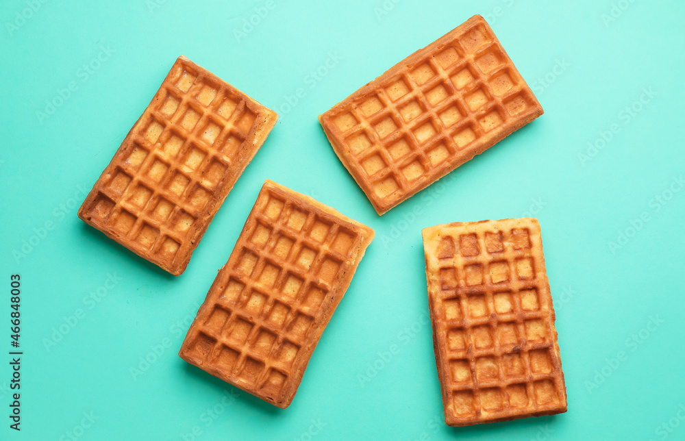 Delicious homemade Belgian waffles on color background Delicious homemade Belgian waffles on color background