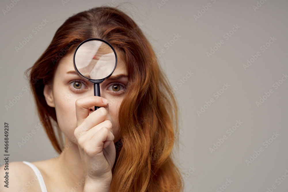 red-haired woman in a white t-shirt pimples on the face close-up red-haired woman in a white t-shirt pimples on the face close-up