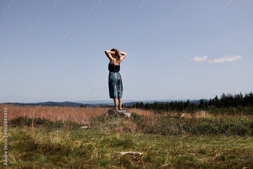 woman doing yoga exercises in the woods woman doing yoga exercises in the woods