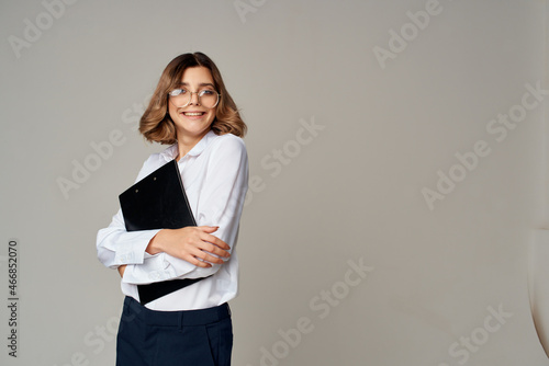 woman in suit official job office success emotions light background
