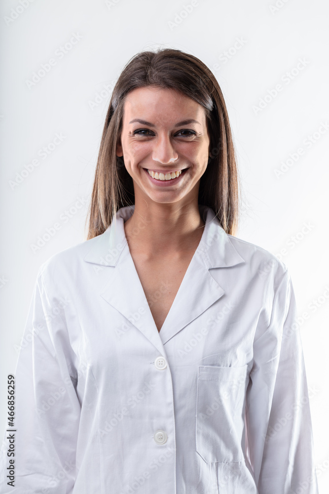 Welcoming motivated young woman in a white lab coat Welcoming motivated young woman in a white lab coat