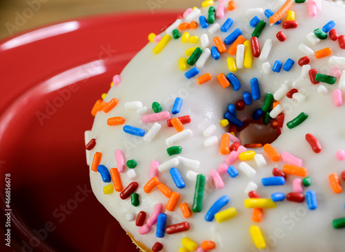 Donut with sprinkles and white icing