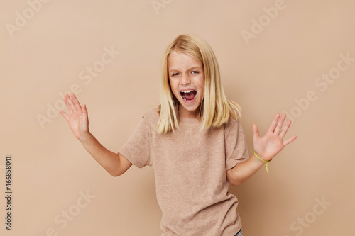 happy cute girl with blond hair posing studio