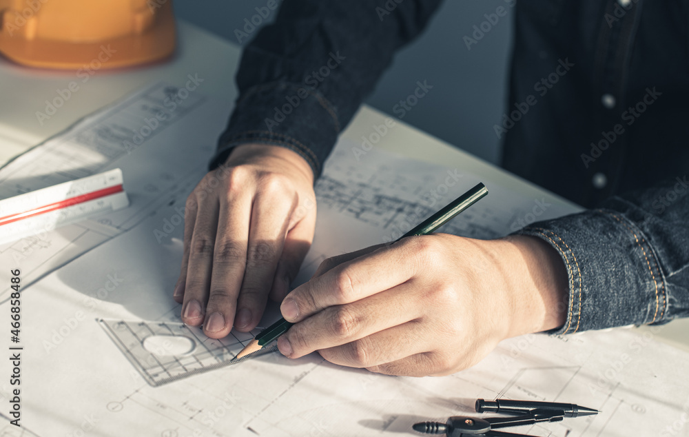 Architect working on blueprint. Architects workplace - architectural ...