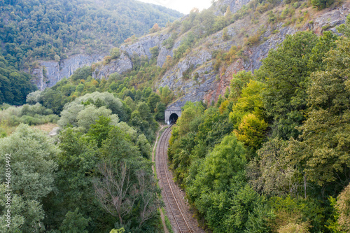 Railway tracks near Crisul Repede river, Apuseni mountains, Bihor, Romania. photo
