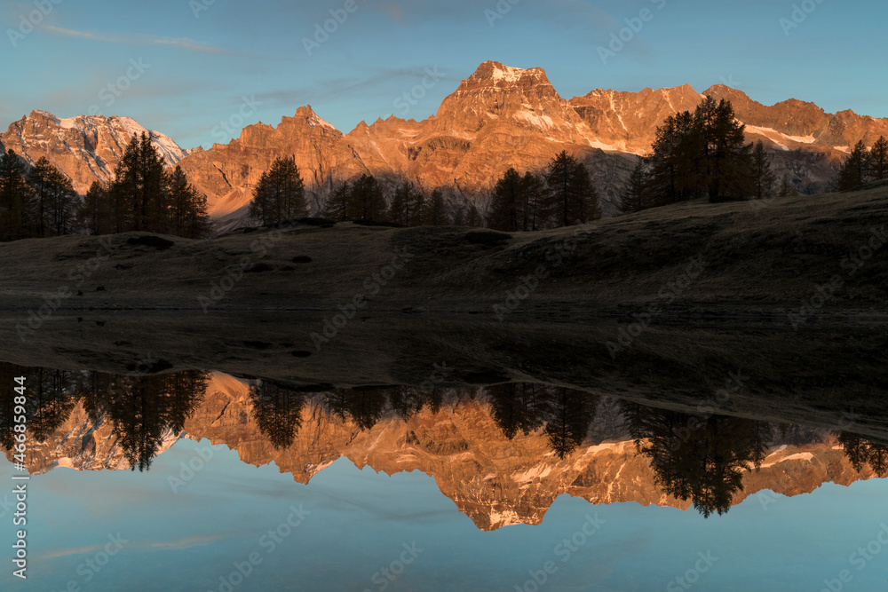 Autumn sunrise with reflections on Scherbadung peak, Alpe Devero and Veglia natural park