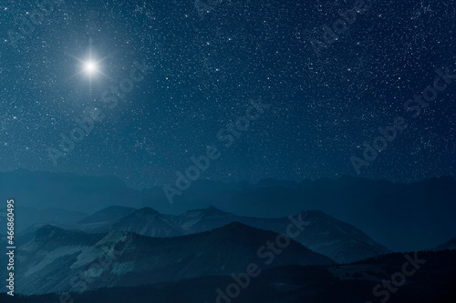 The star shines over the manger of christmas of Jesus Christ.