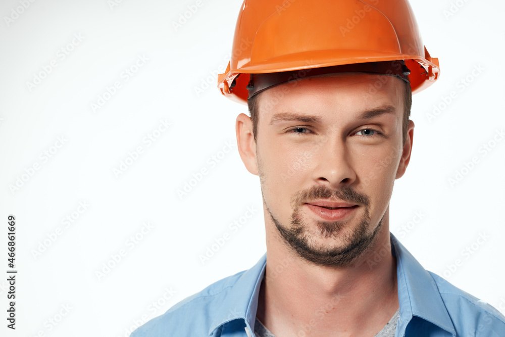 male builder in a blue shirt emotions professional studio posing male builder in a blue shirt emotions professional studio posing