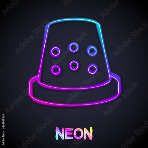 Glowing neon line Thimble for sewing icon isolated on black background. Vector
