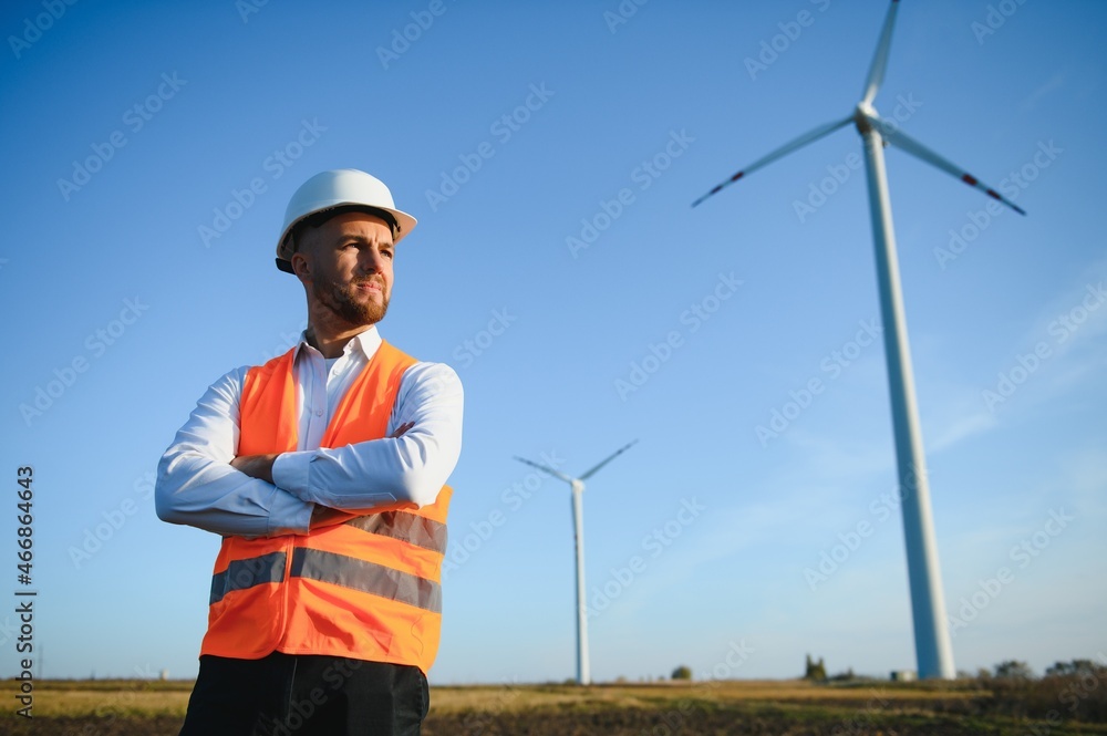 Businessmen engineering standing handsome smile front of turbine looking away Businessmen engineering standing handsome smile front of turbine looking away