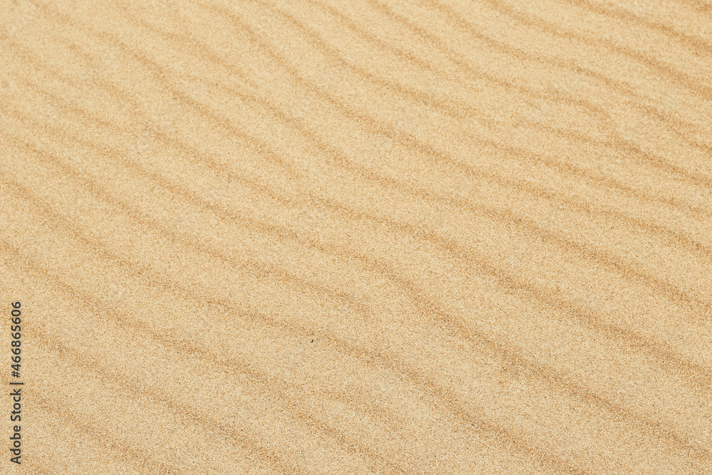 Sand texture. Sandy beach for background. Top view. Natural sand stone texture background. sand on the beach as background. Wavy sand background for summer designs. Sand texture. Sandy beach for background. Top view. Natural sand stone texture background. sand on the beach as background. Wavy sand background for summer designs.