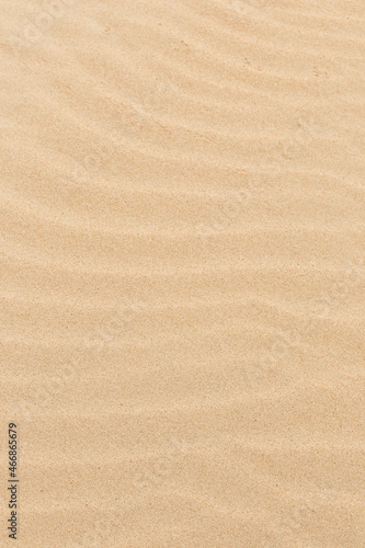 Sand texture. Sandy beach for background. Top view. Natural sand stone texture background. sand on the beach as background. Wavy sand background for summer designs.