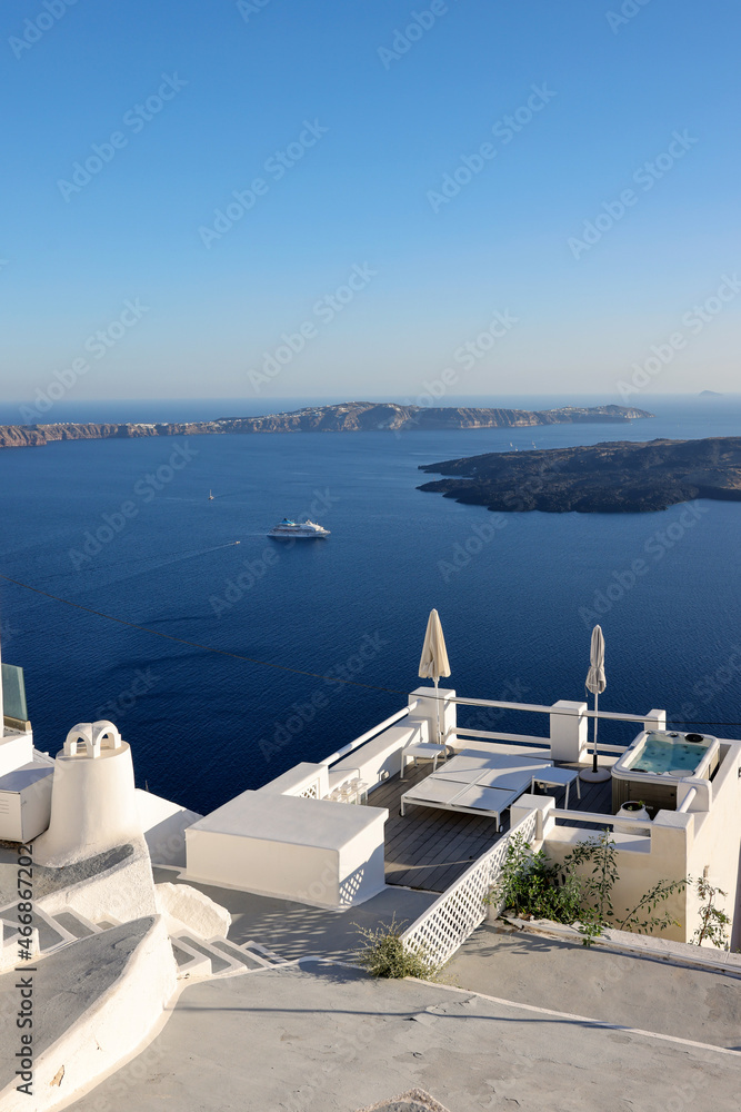 Fototapeta premium Beautiful white terrace in the village of Imerovigli with amazing view on caldera. Santorini, Greece