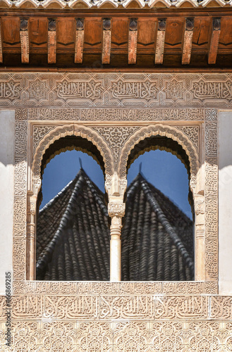 Reflection in a window of an old building in Granada in Andalusia.