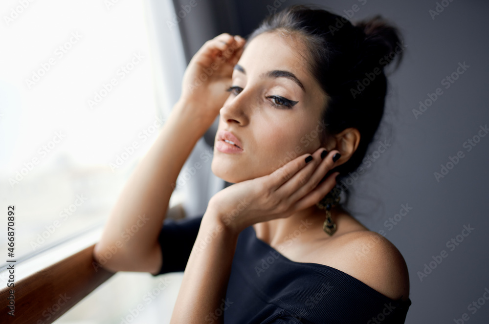 brunette near window posing attractive look earrings elegant style brunette near window posing attractive look earrings elegant style