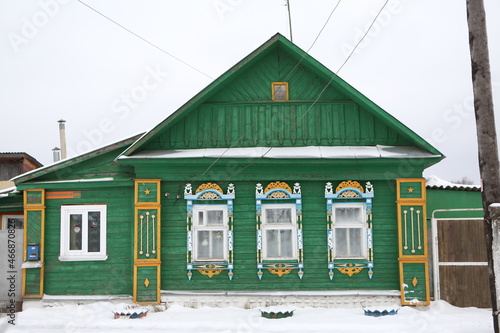 Vintage wooden rural house with ornamental windows, carved frames in Nerekhta town, Kostroma region, Russia. Russian folk style in architecture. Village. Landmark photo