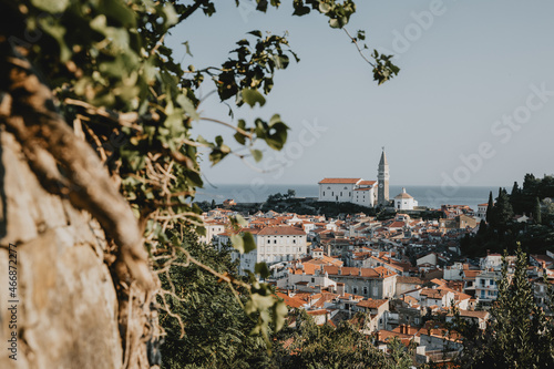 Panoramic view of the old historical coastal Slovenia town Piran with typical tower near the Adriatic sea