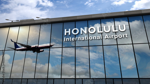 Airplane landing at Honolulu Hawaii, USA airport mirrored in terminal