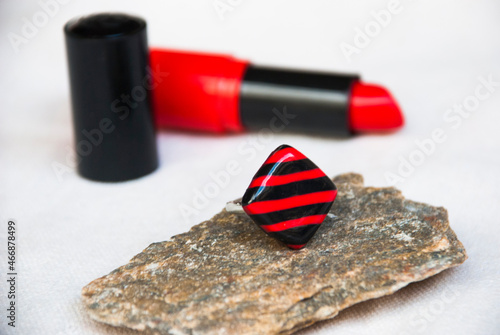 Striped red blck ring of pilymer cly. Geometric jewelry. photo