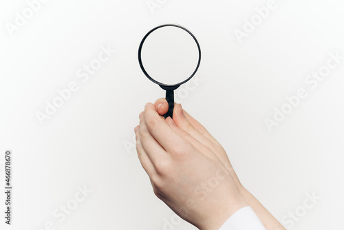 magnifier in hand tool search lcd light background