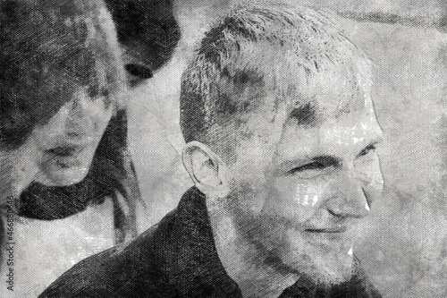 Monochrome portrait of a laughing young man. Woman with long loose hair in the background.