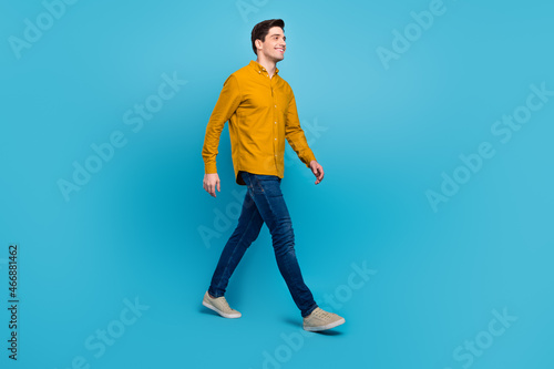 Fototapeta Profile photo of handsome guy enjoy stroll wear yellow shirt jeans footwear isol
