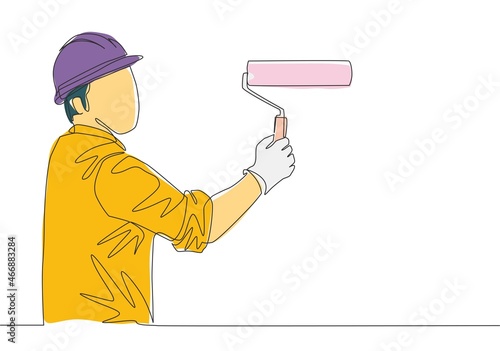 One single line drawing of young workman painting construction building wall with paint roller. Painter wall renovation service concept. Continuous line draw design illustration