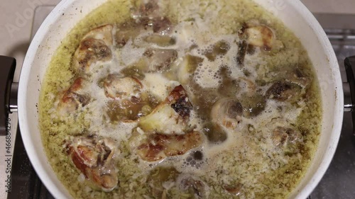 Conejo al ajillo is a traditional spanish recipe with rabbit. Top view