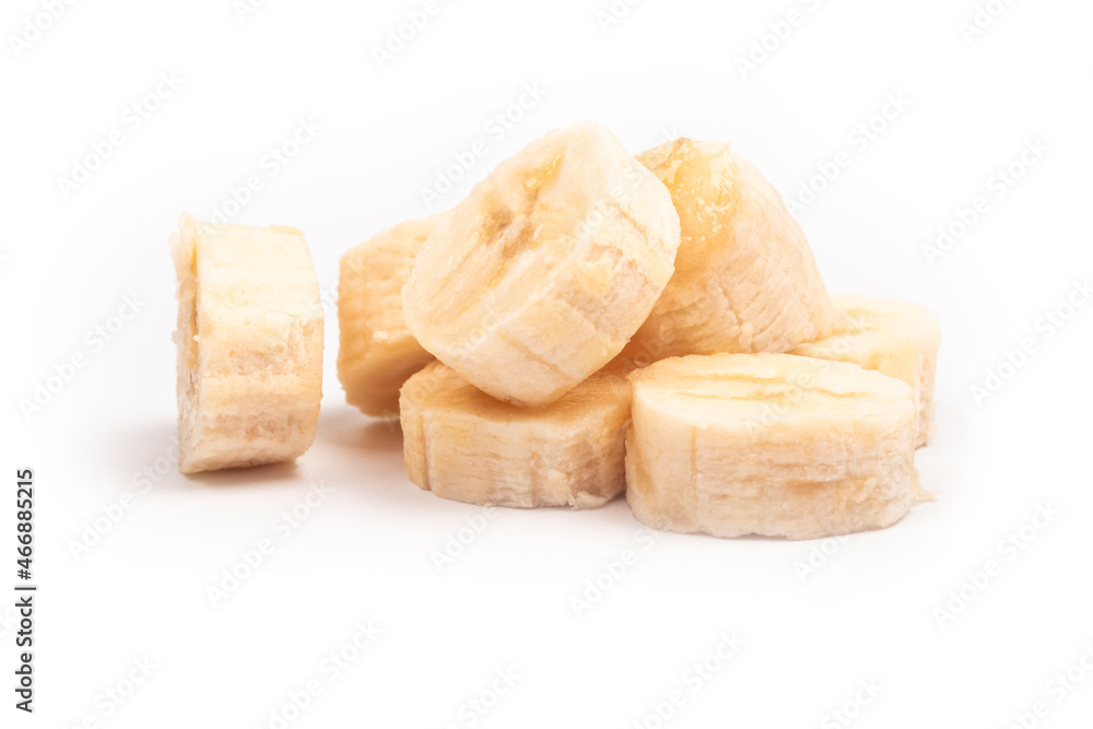 on a white background. peeled banana, cut into pieces. close-up.