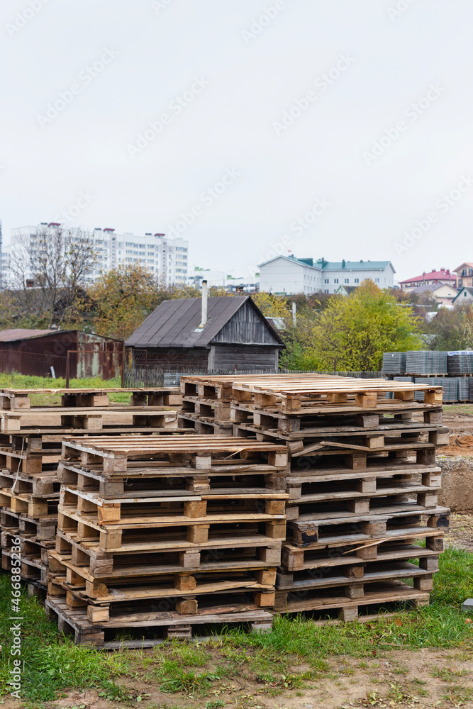 Wooden pallets for transporting building materials on a construction site Wooden pallets for transporting building materials on a construction site