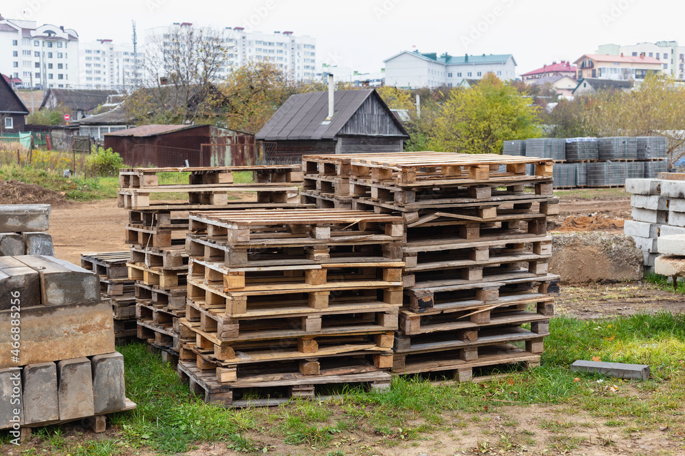 Wooden pallets for transporting building materials on a construction site