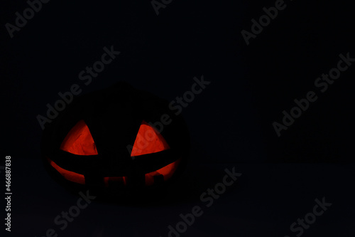 jack o lantern, dark halloween background with space for text