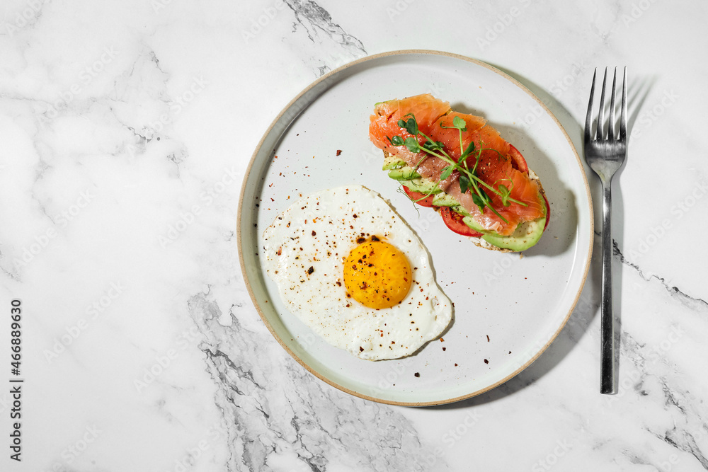 breakfast fried egg with toast with avocado and salted salmon breakfast fried egg with toast with avocado and salted salmon