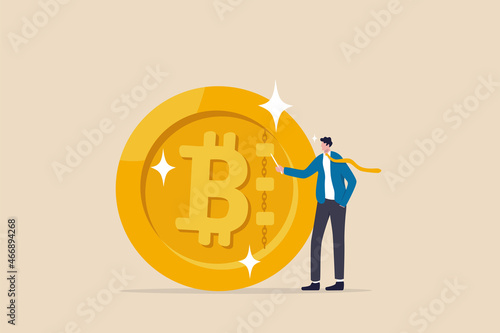 What is Bitcoin and blockchain technology, knowledge or crypto currency technology, blockchain class and education concept, businessman expert explain blockchain technology on golden Bitcoin coin.