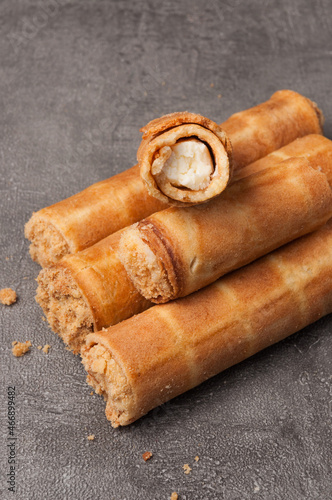 waffle tubes with cottage cheese on a gray background