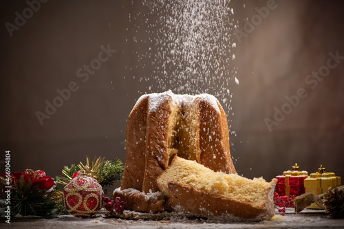 Traditional Italian Christmas cake Pandoro with christmas decoration and gifts. photo