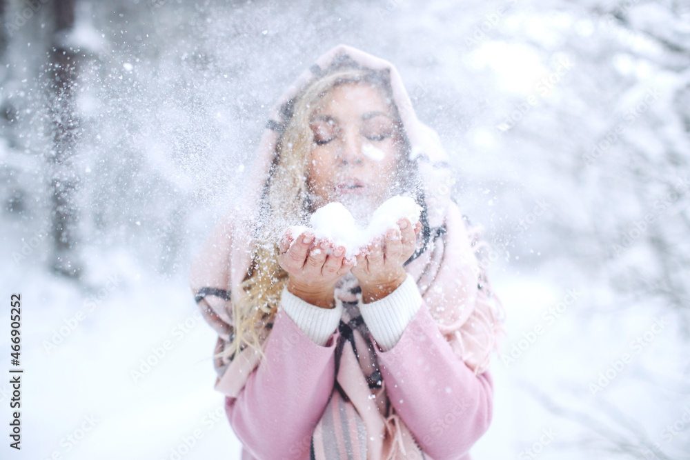 Winter woman in the snow. Beautiful girl in the winter in nature. High quality photo Winter woman in the snow. Beautiful girl in the winter in nature. High quality photo