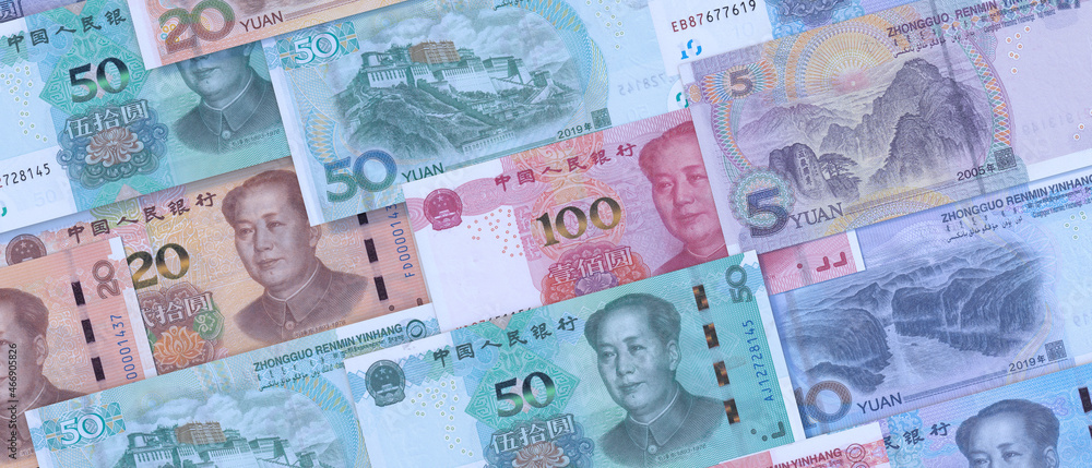 Chinese paper currency Yuan renminbi bill banknotes background. China economy, finance and banking Chinese paper currency Yuan renminbi bill banknotes background. China economy, finance and banking