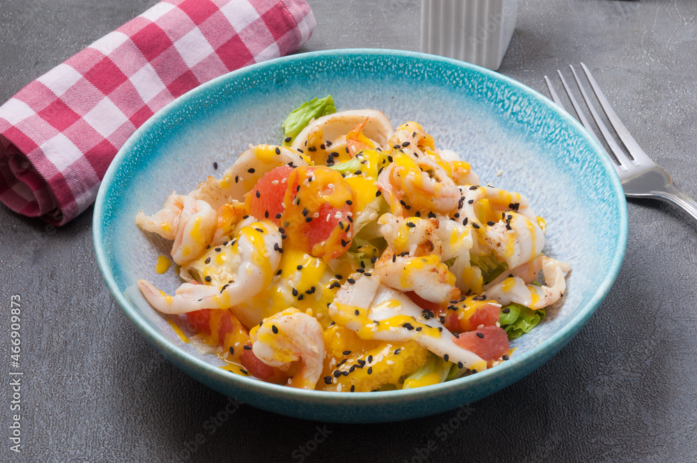 salad with squid, shrimp, orange and grapefruit