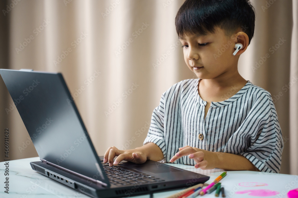 Distance learning online education,A home distance learning,is using a laptop and communicates on the Internet at home. homeschooling, Distance learning online education,A home distance learning,is using a laptop and communicates on the Internet at home. homeschooling,