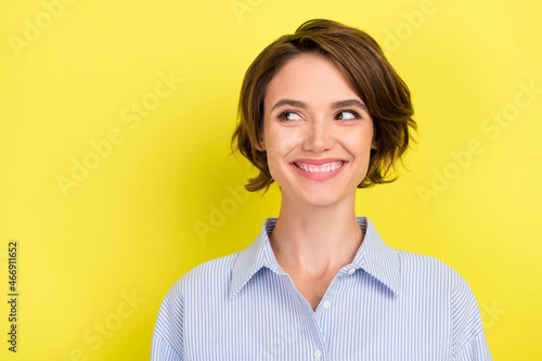 Photo of young cheerful woman happy positive smile curious think isolated over yellow color background © deagreez