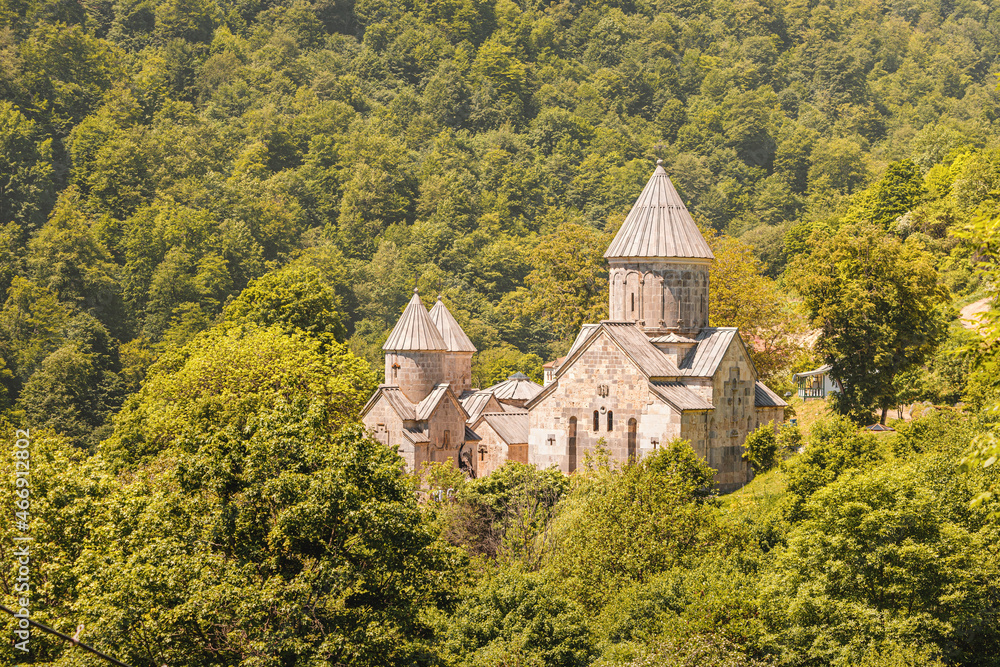 Obraz premium Armenian Haghartsin Monastery (founded in the 11th century) among lush forest and mountains of Dilijan national park